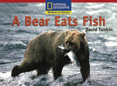 A bear eats fish