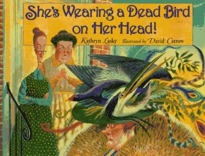 She's wearing a dead bird on her head!