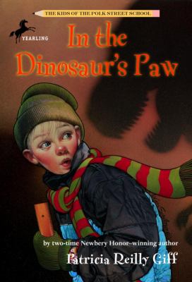 In the dinosaur's paw